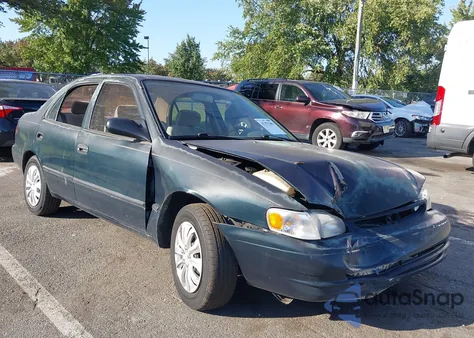 1999 Toyota Corolla Ce из США, поврежденный, VIN 2T1BR12E4XC238429